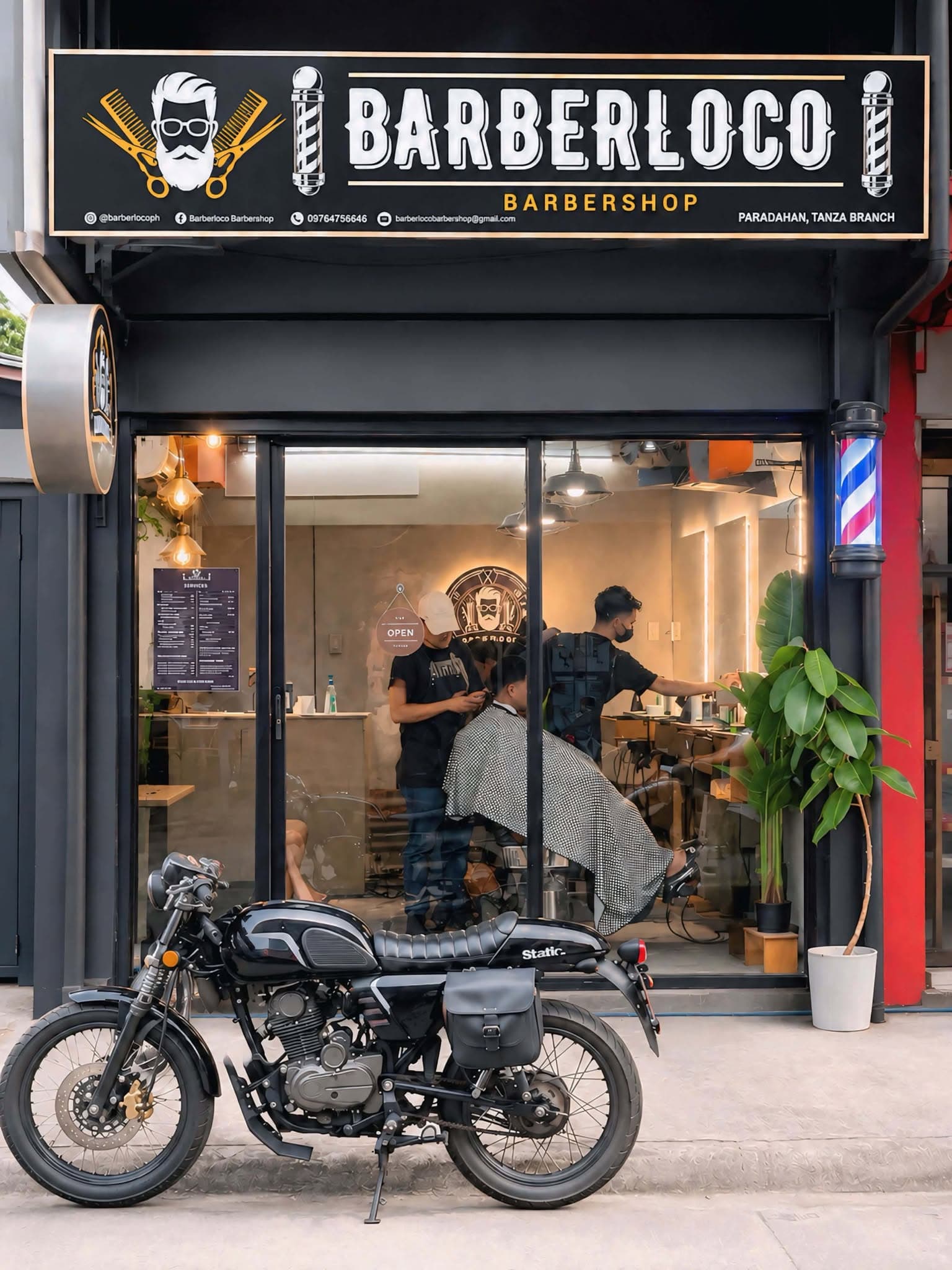 Barbers at work in the Barberloco shop